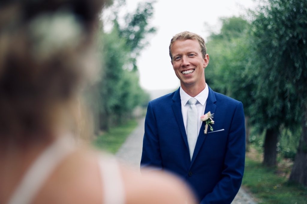 man smiling at his bride