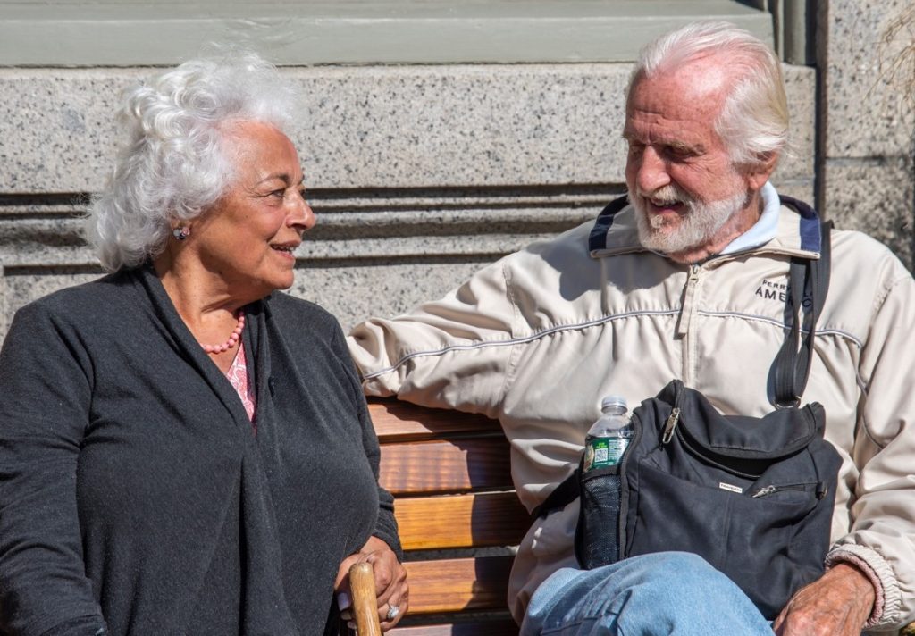 old couple sitting on a bench