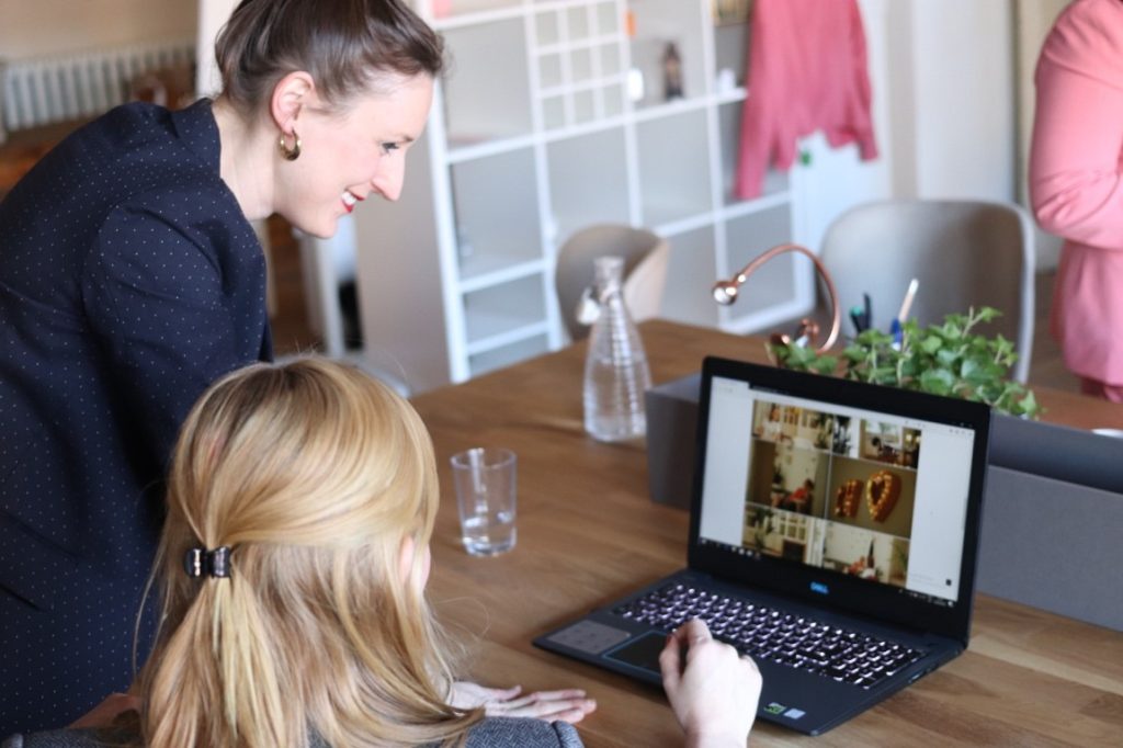 wedding planner and bride looking at a laptop