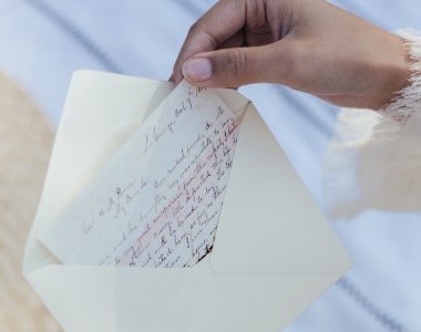 woman opening a letter