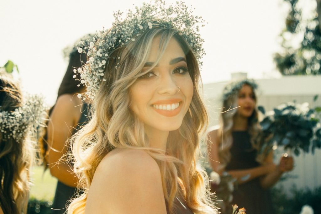 woman with flower crown smiling