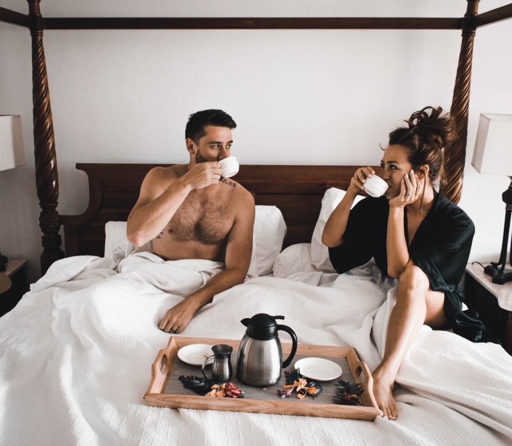 couple drinking tea at bed