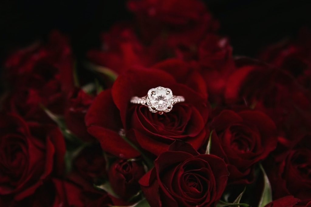 engagement ring on a bouquet of roses