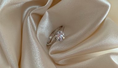silver diamond ring on silk fabric
