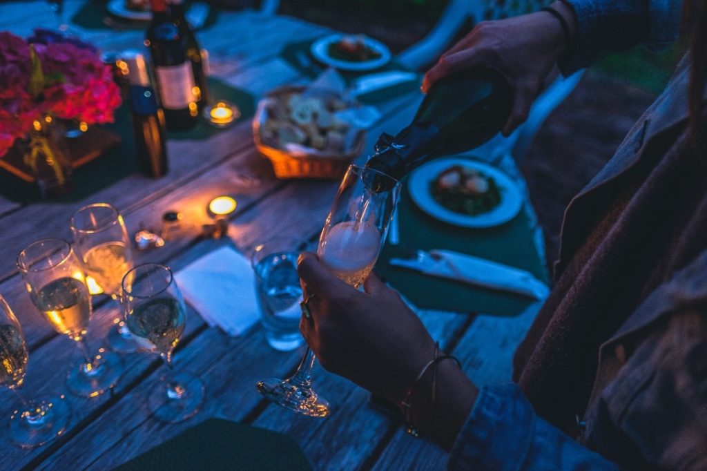 woman pouring wine on glass