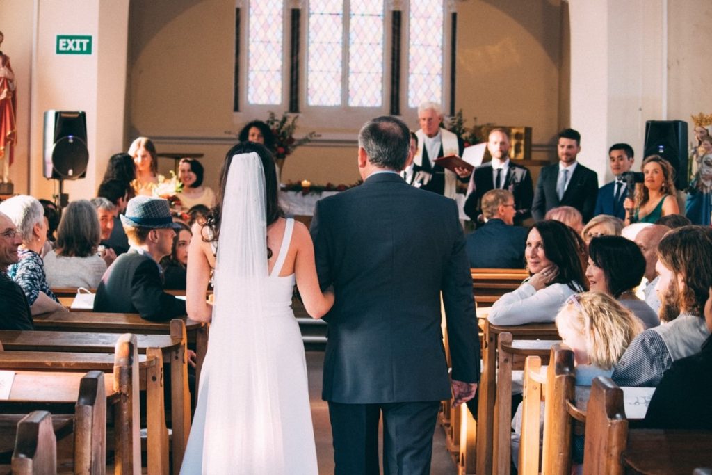 bride and father walking down the isle