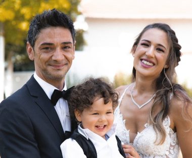 bride and groom holding baby boy