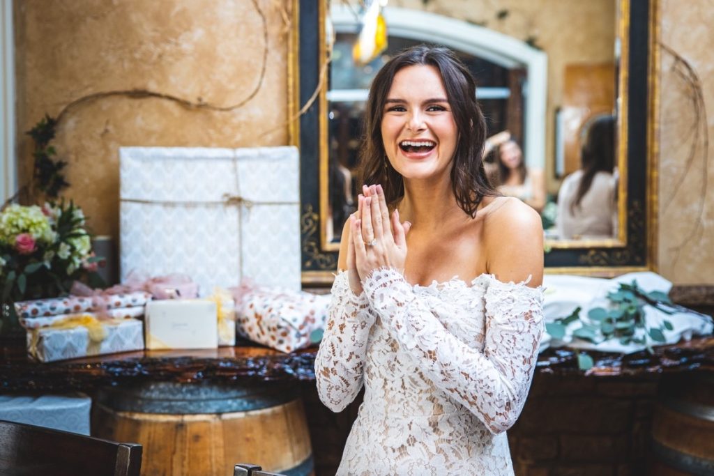 bride in front of wedding gifts