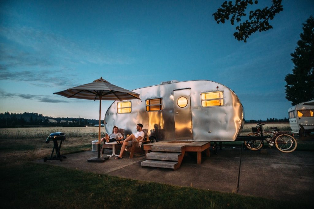 couple sitting outside motor house