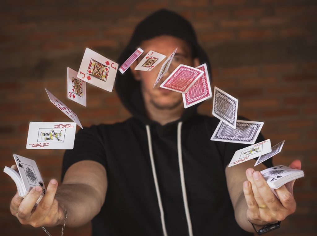 magician playing with cards