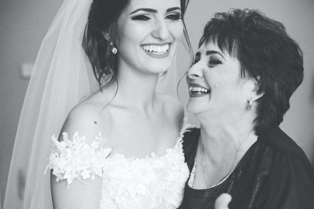 mother and bride smiling