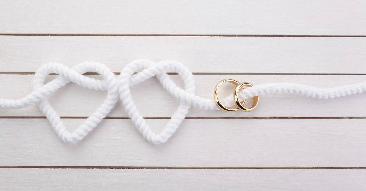 white rope and wedding rings