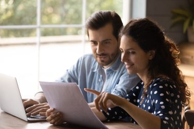 couple looking at a paper