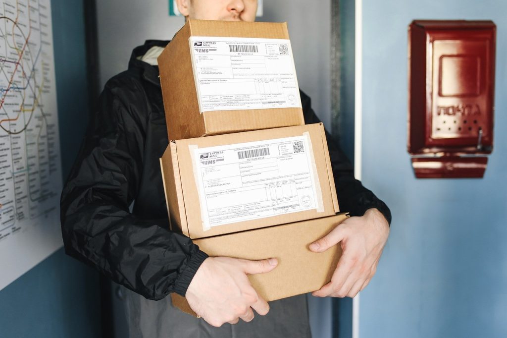 delivery man holding boxes