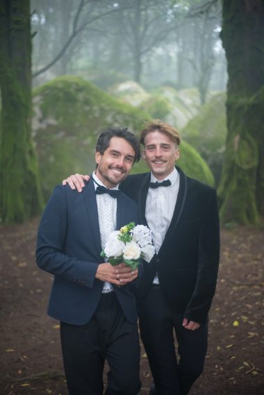 gay couple wearing tuxedo