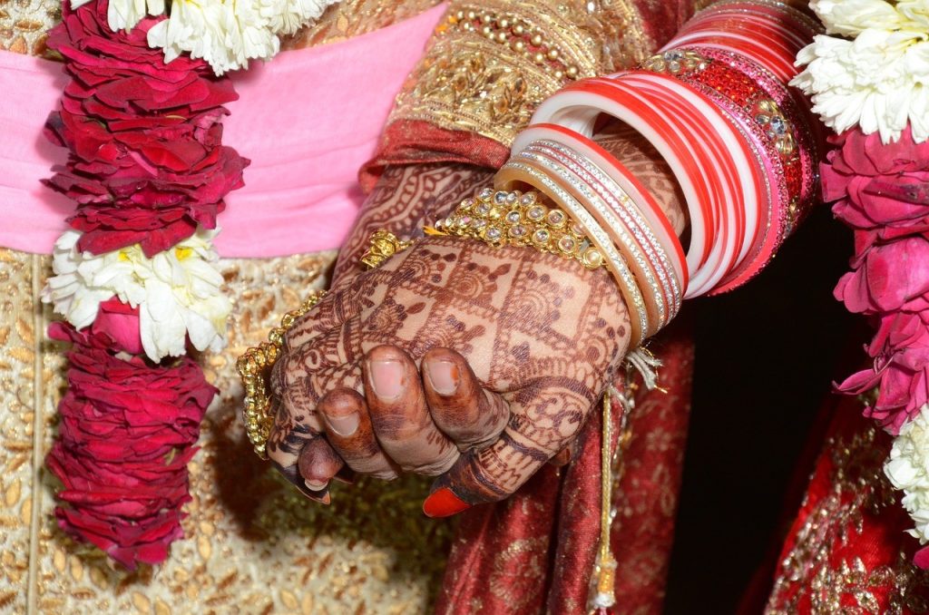 henna on newlyweds hands