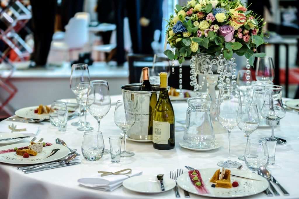 table filled with wine glass and food