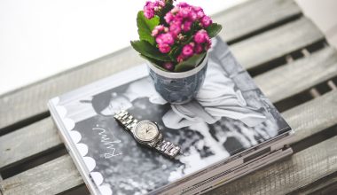 watch, magazines, and flower vase