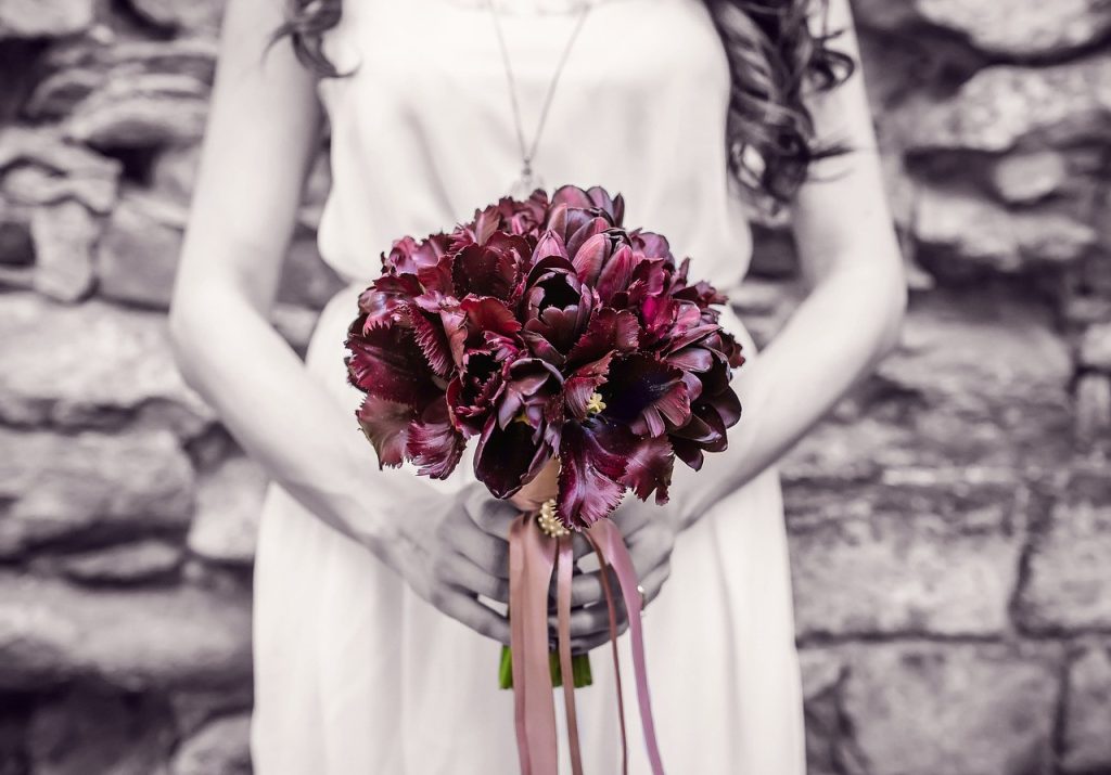 woman holding a bouquet of flowers