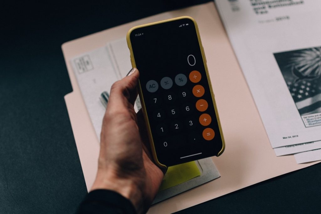 woman opening calculator on her phone