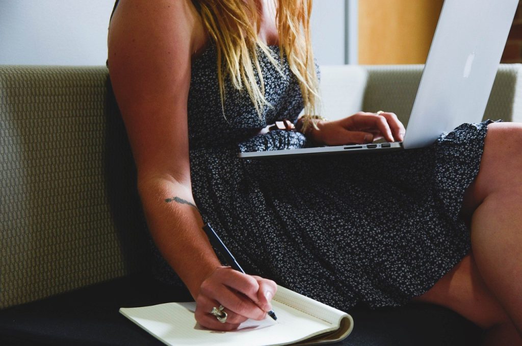 woman taking notes