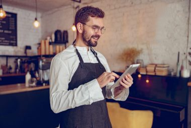 bartender looking at tablet