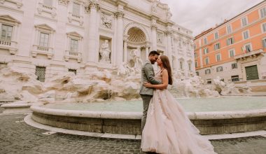bride and groom in front of trevi fountain