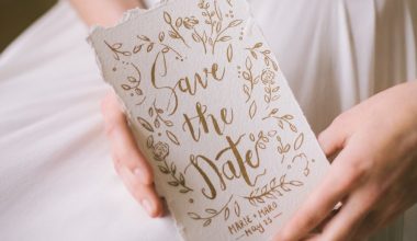 bride holding save the date card