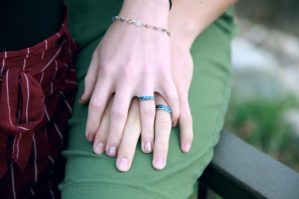 couple wearing promise ring