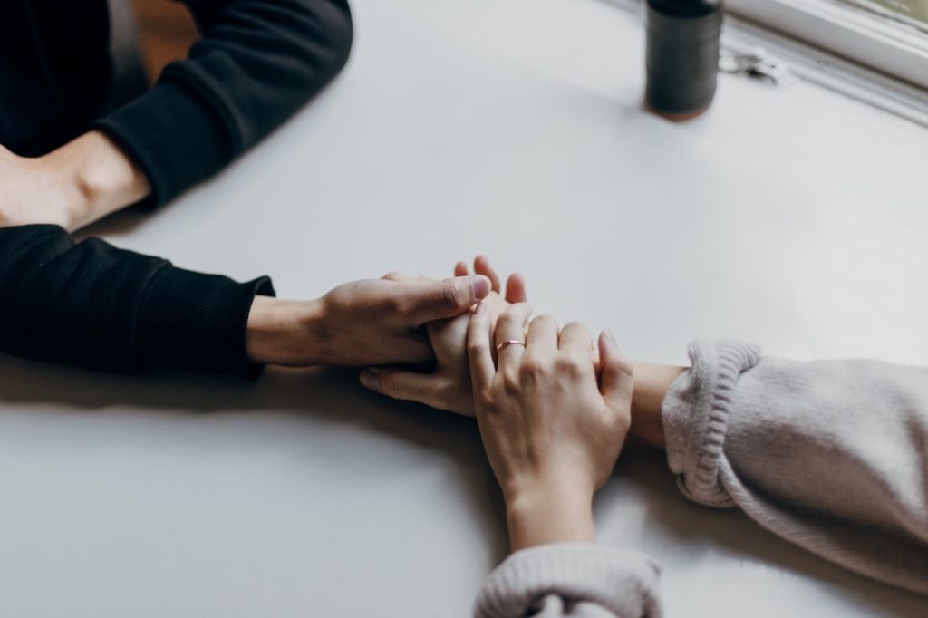 man and woman holding hands