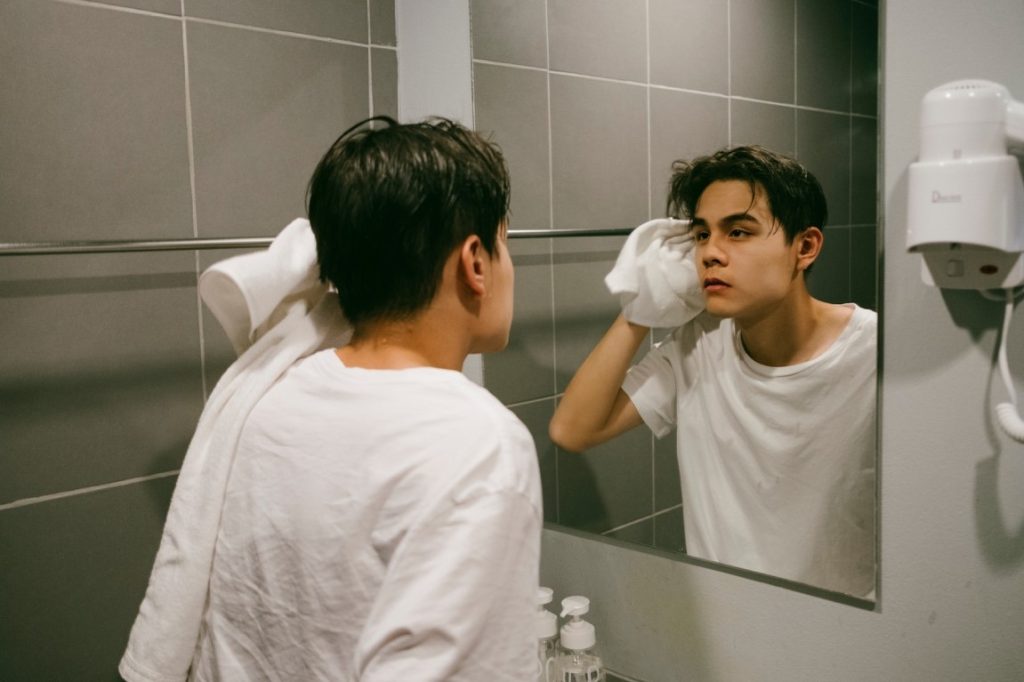 man looking at the mirror