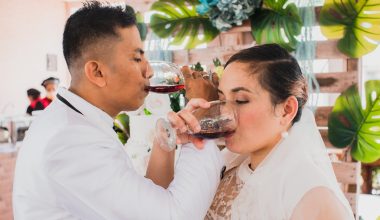 newlyweds drinking wine together