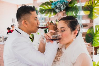 newlyweds drinking wine together
