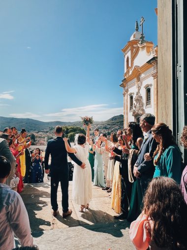 people greeting newlyweds