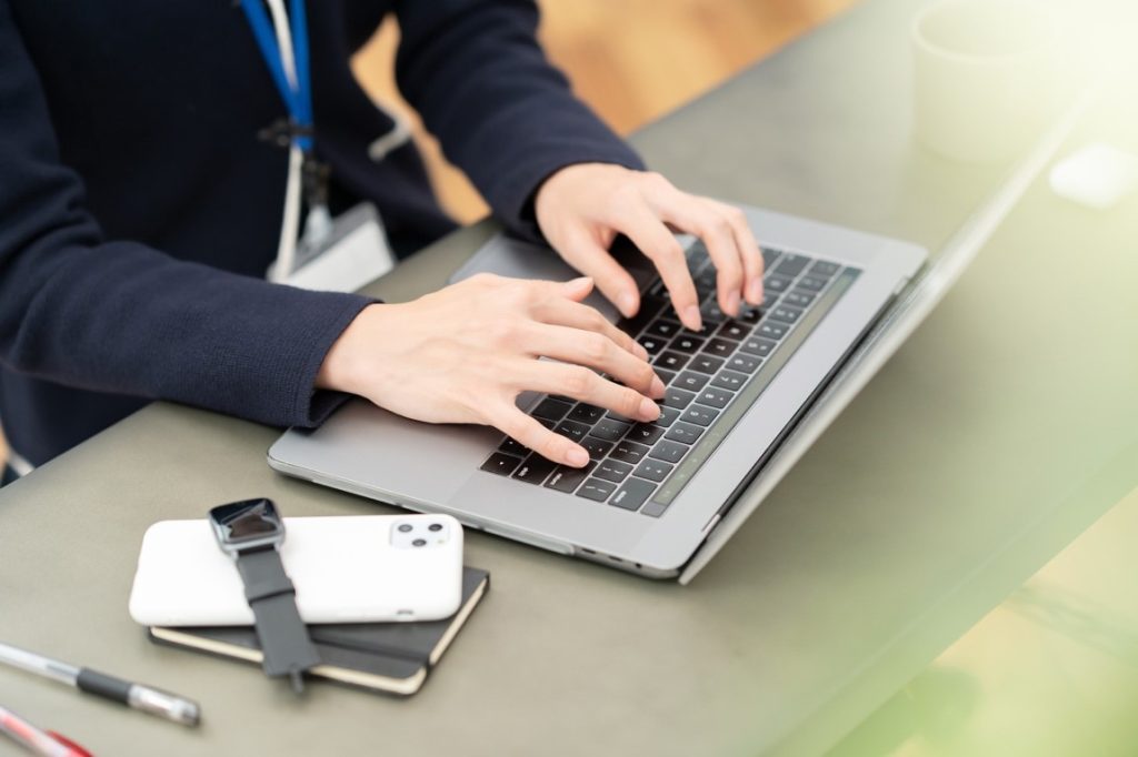 person typing on laptop