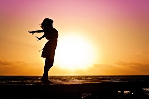 silhoutte of a woman basking in sun