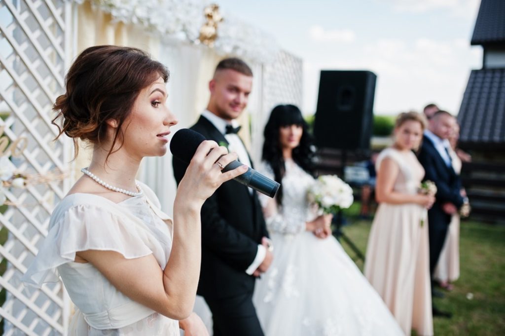 woman giving a speech during a wedding