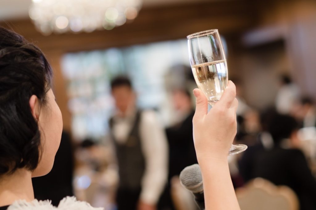 woman raising her glass