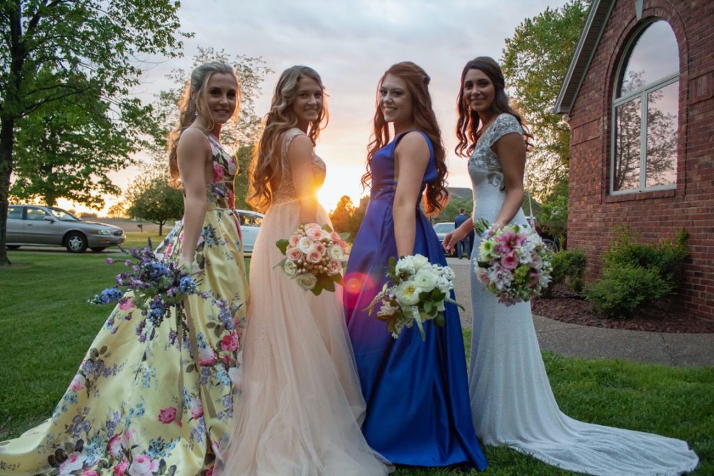 bride and bridesmaids holding bouquet