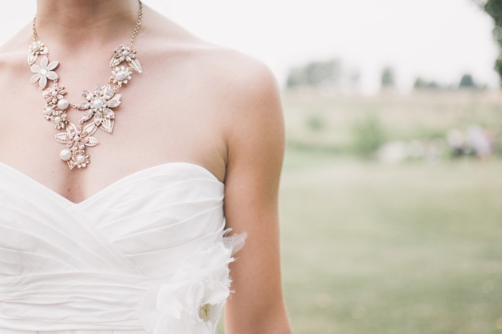 bride with flower necklace