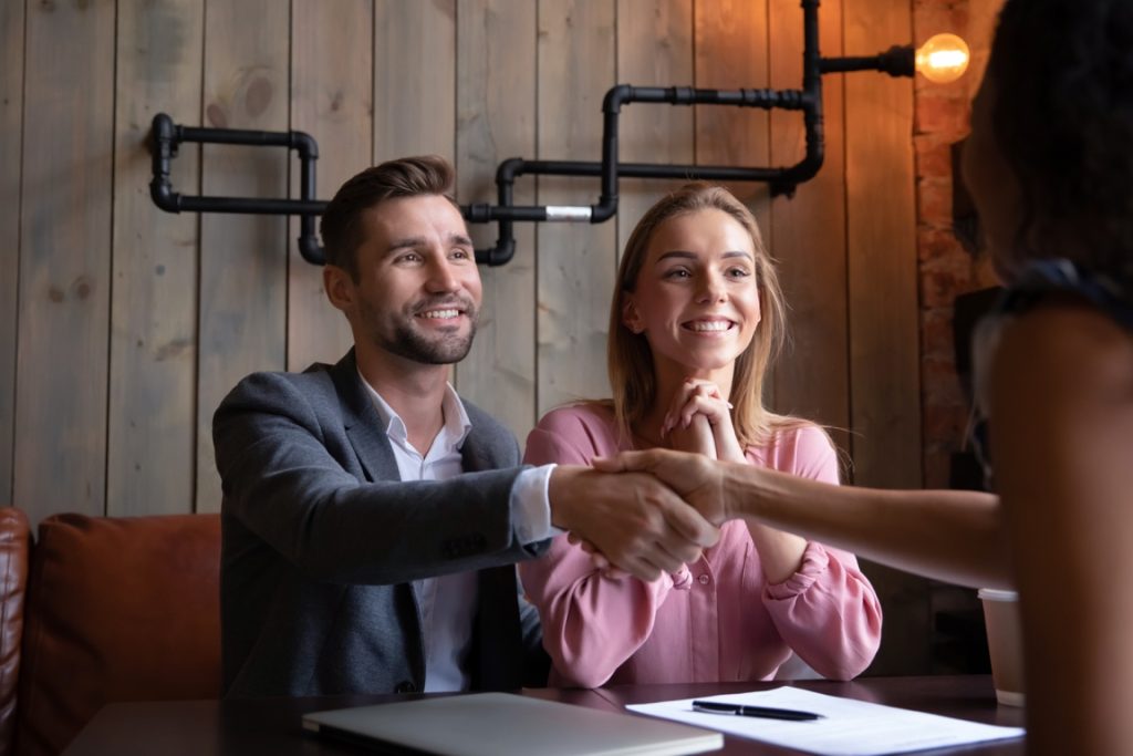 couple making a deal with someone