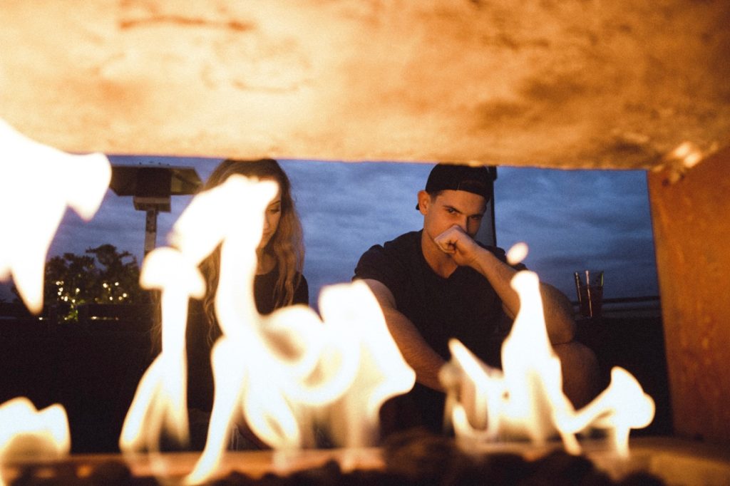 couple near a fireplace