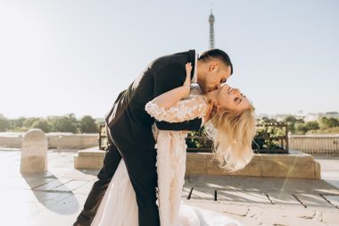 groom kissing bride's neck