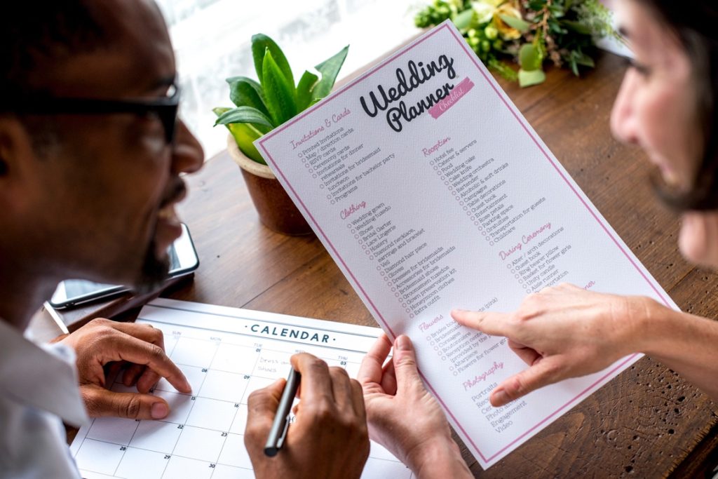 man and woman planning a wedding