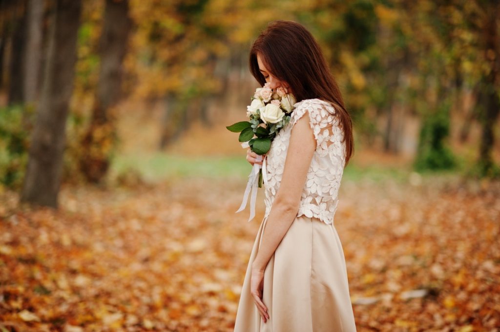 woman smelling bouquet