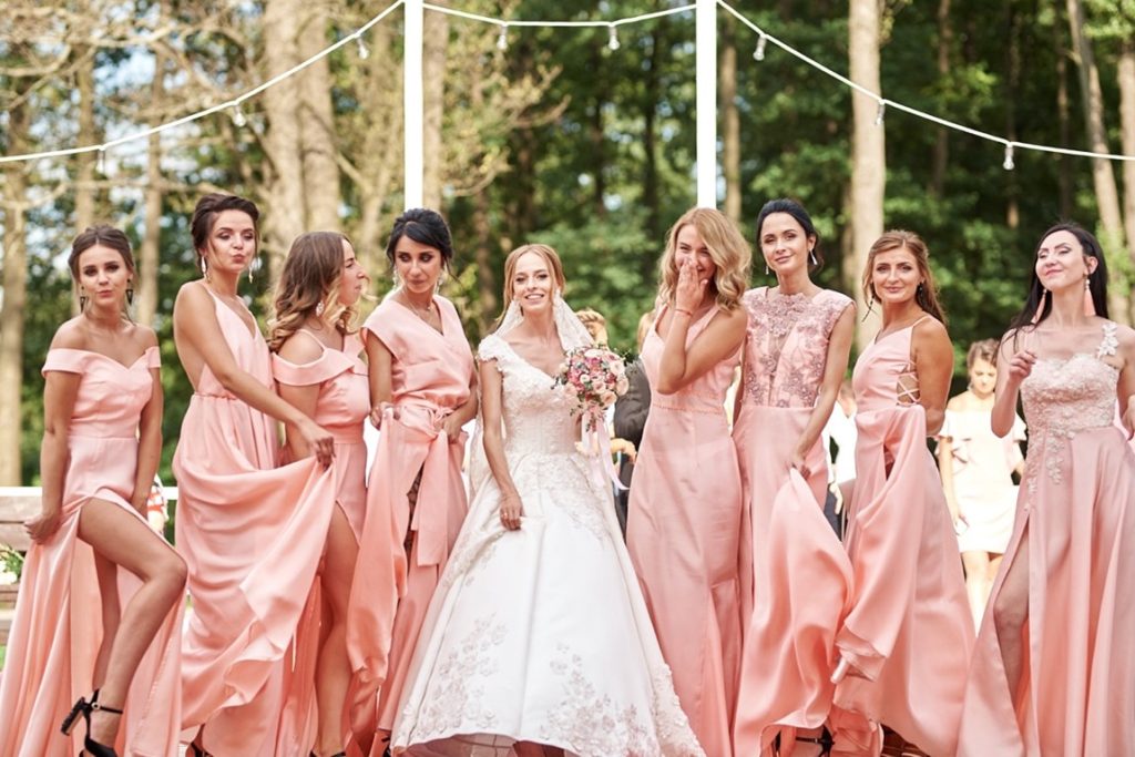 bride and bridesmaids posing for picture