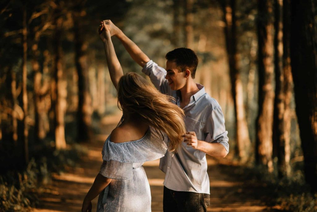 couple dancing on a forest