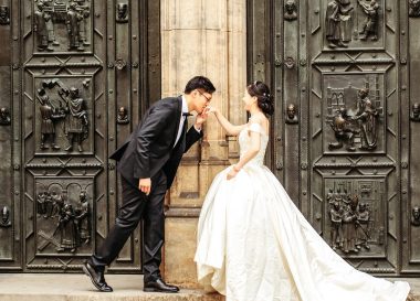 groom kissing brides hand