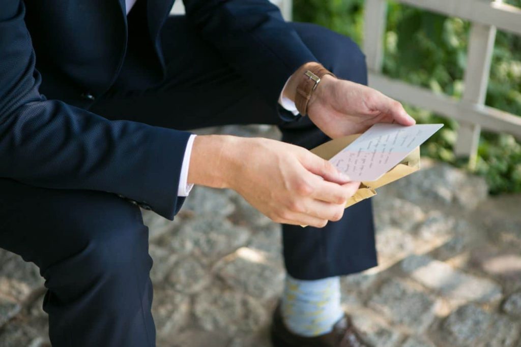 groom reading a letter