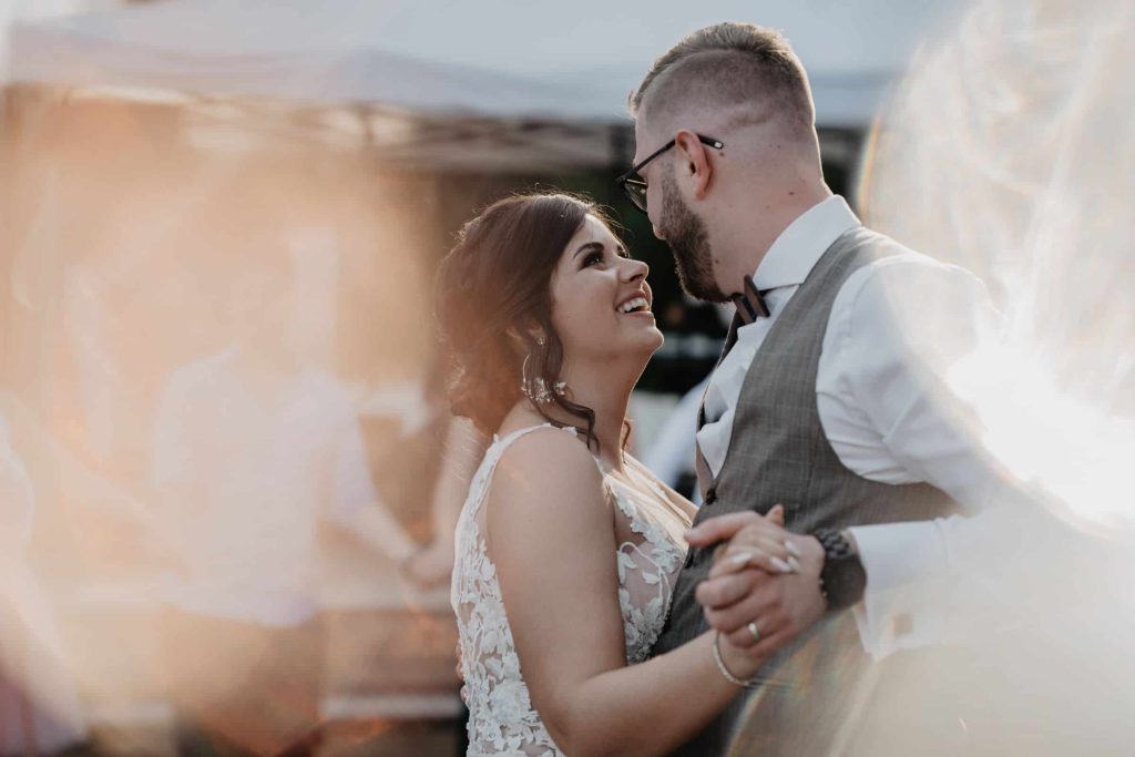 newlyweds dancing and smiling